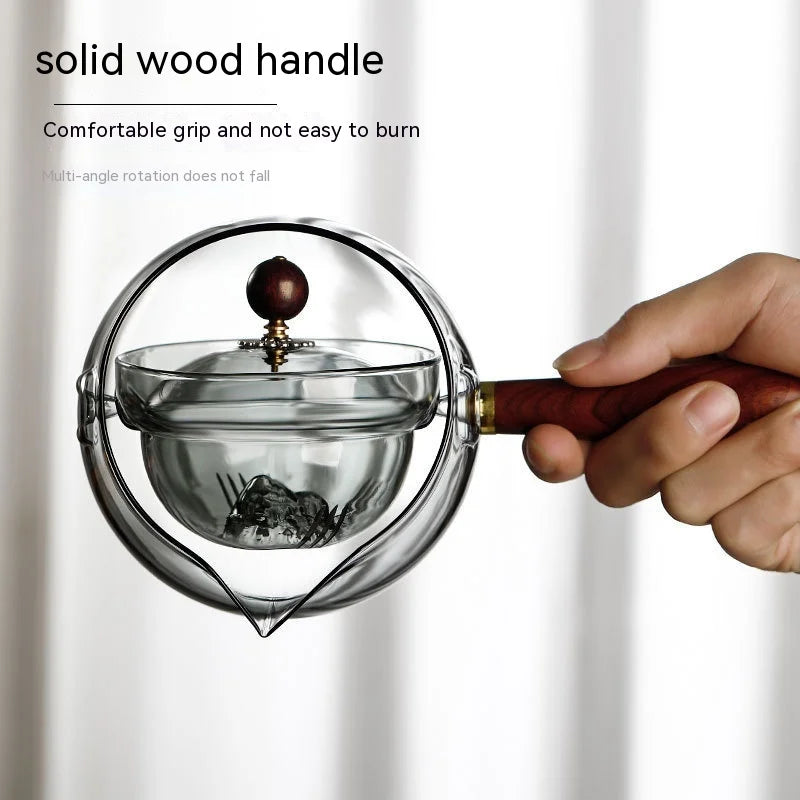 Draaiende glazen theepot met infuser