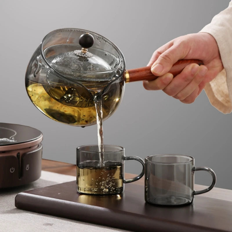 Draaiende glazen theepot met infuser