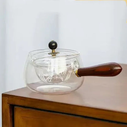 Draaiende glazen theepot met infuser