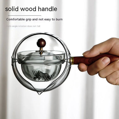 Draaiende glazen theepot met infuser